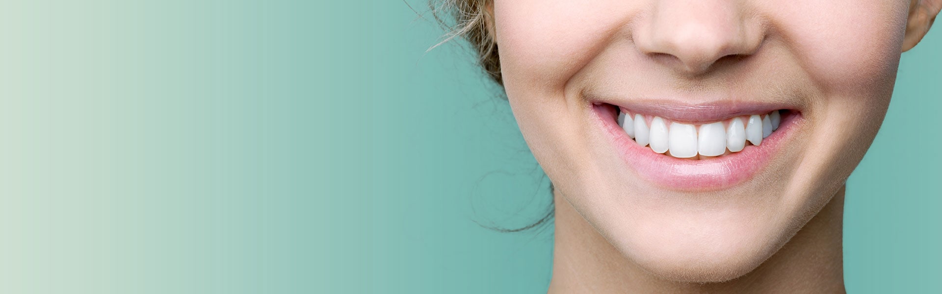 Beautiful smile of young woman with healthy white teeth